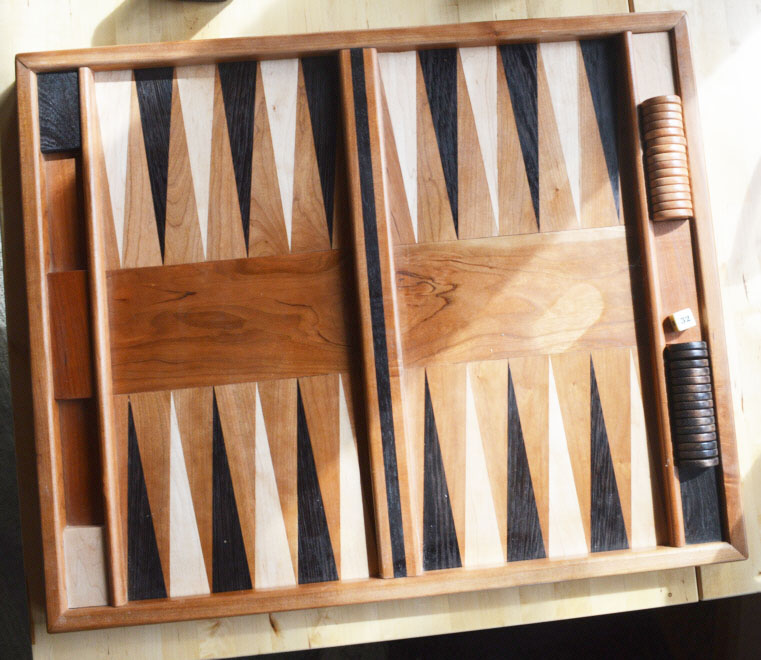 Anyone for backgammon? Commercial boards' diamond-shaped pieces are laminated to a substrate. Chuck makes his of solid wood. It takes real precision to do this kind of work!