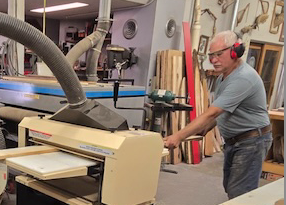 Tim Heming runs his Woodmaster Planer